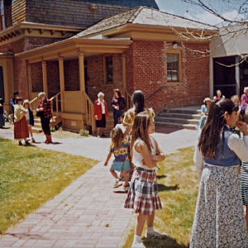 Participants at a “Kids and Toys Tea Party” in the Museum courtyard, early 1990s (Photo courtesy of the Silver City Museum).